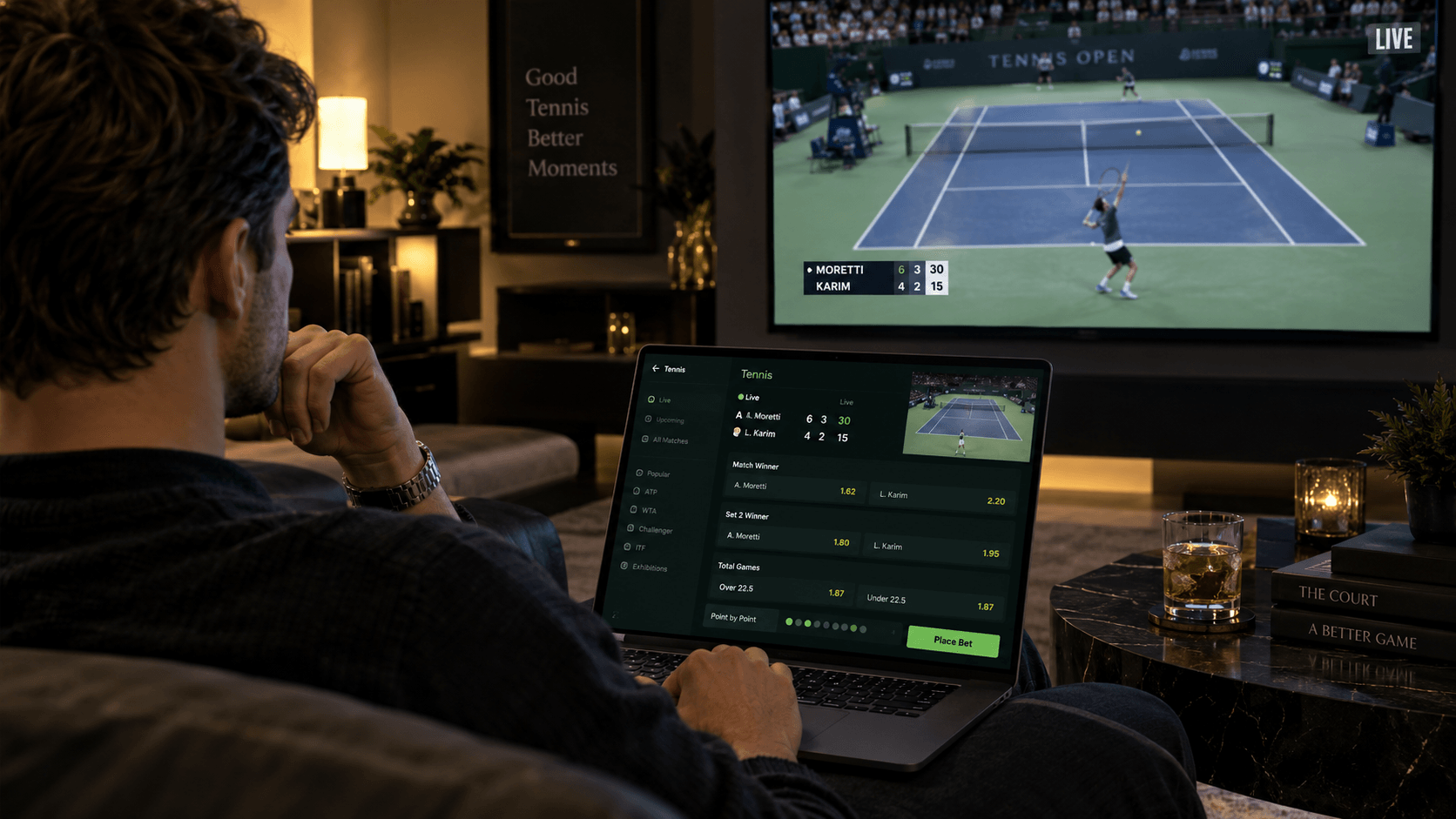Person live betting on a tennis match on a laptop while watching the match on TV, with live odds and in-play betting markets displayed.